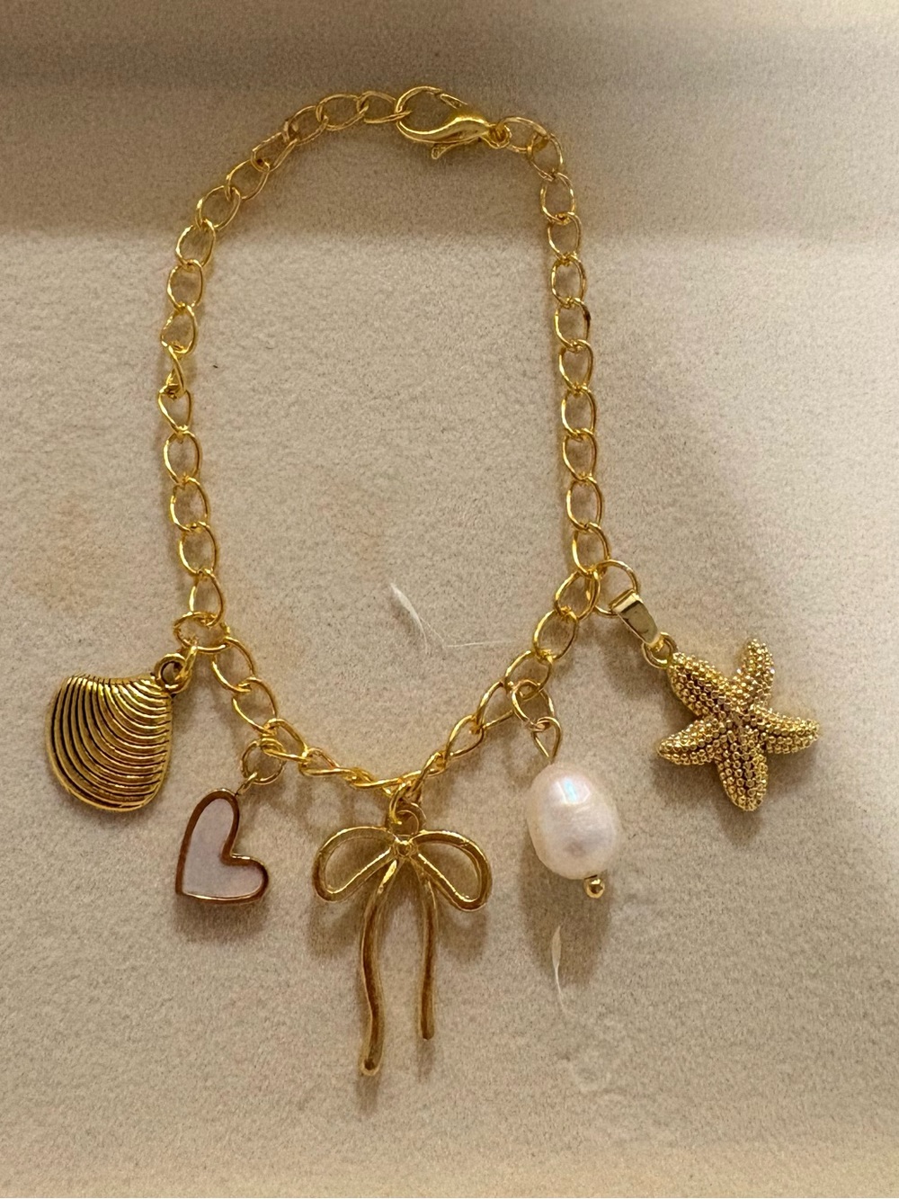 Gold Charm Bracelet with Bow, Heart, Pearl & Starfish Charms